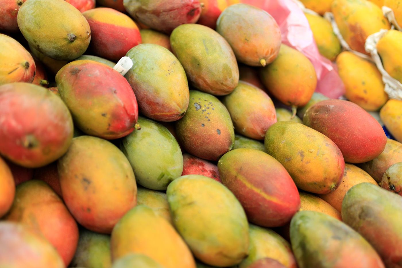 Ripe mangoes at a market stall